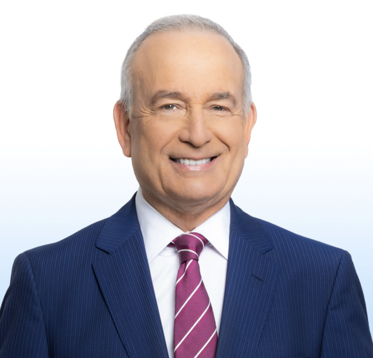 This is an image of Eliott Rodriguez, candidate for Florida's 27th Congressional District. He is pictured in a blue suit with a white shirt and red tie in front of a blue-white gradient background.